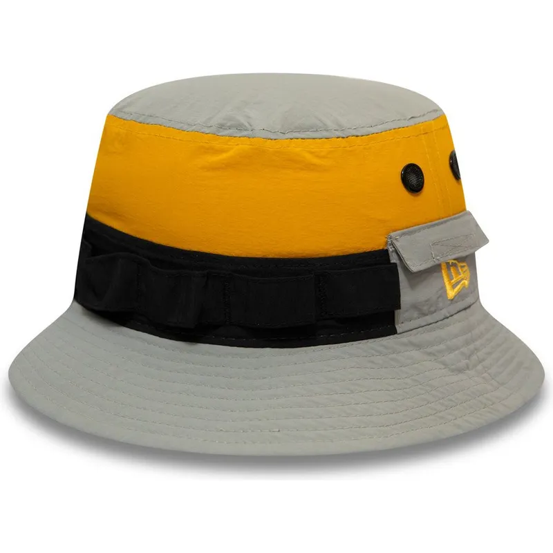 eimer-grau-der-bucket-gris-negro-y-amarillo-panelled-adventure-von-new-era eimer-grau-der-bucket-gris-negro-y-amarillo-panelled-adventure-von-new-era
