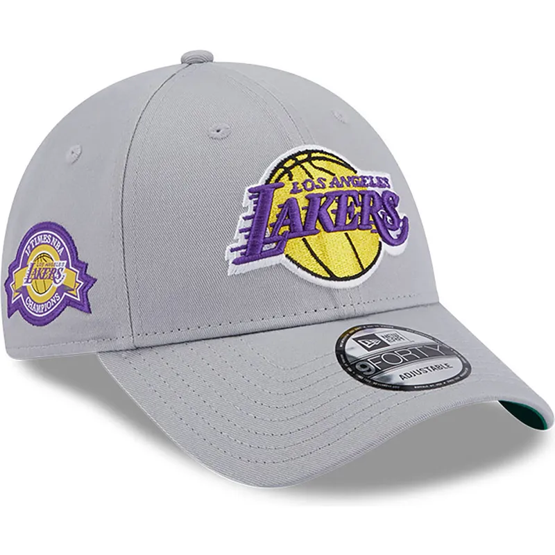 graue-verstellbare-curved-cap-9forty-team-side-patch-der-los-angeles-lakers-nba-von-new-era