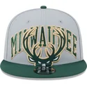 mutzen-flach-grau-snapback-9fifty-tip-off-2023-der-milwaukee-bucks-nba-von-new-era