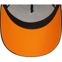 schwarz-orangefarbene-9forty-a-frame-patch-front-trucker-kappe-von-mclaren-racing-formula-1-von-new-era