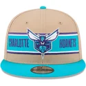braune-und-blaue-snapback-kappe-9fifty-draft-2024-der-charlotte-hornets-nba-von-new-era