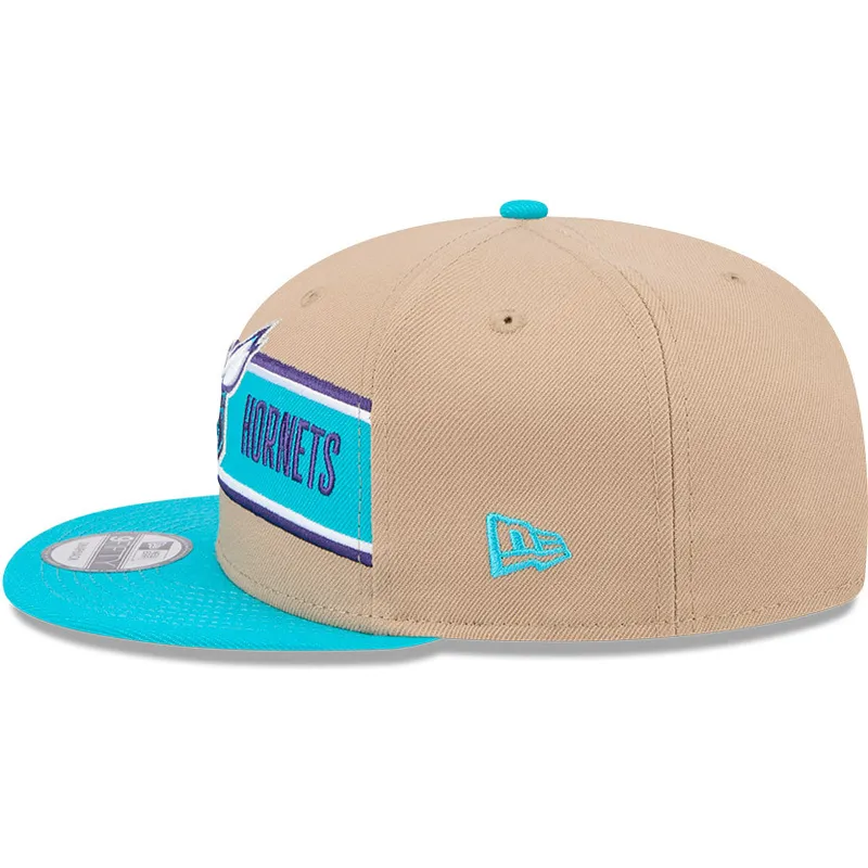 braune-und-blaue-flatcap-snapback-9fifty-draft-2024-der-charlotte-hornets-nba-von-new-era